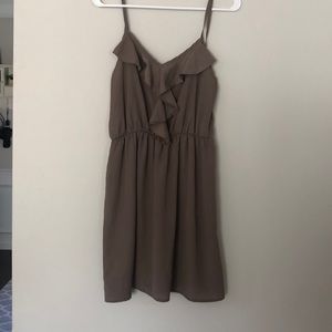 Beige/tan ruffle dress.